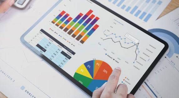 Tablet displaying colorful charts, graphs